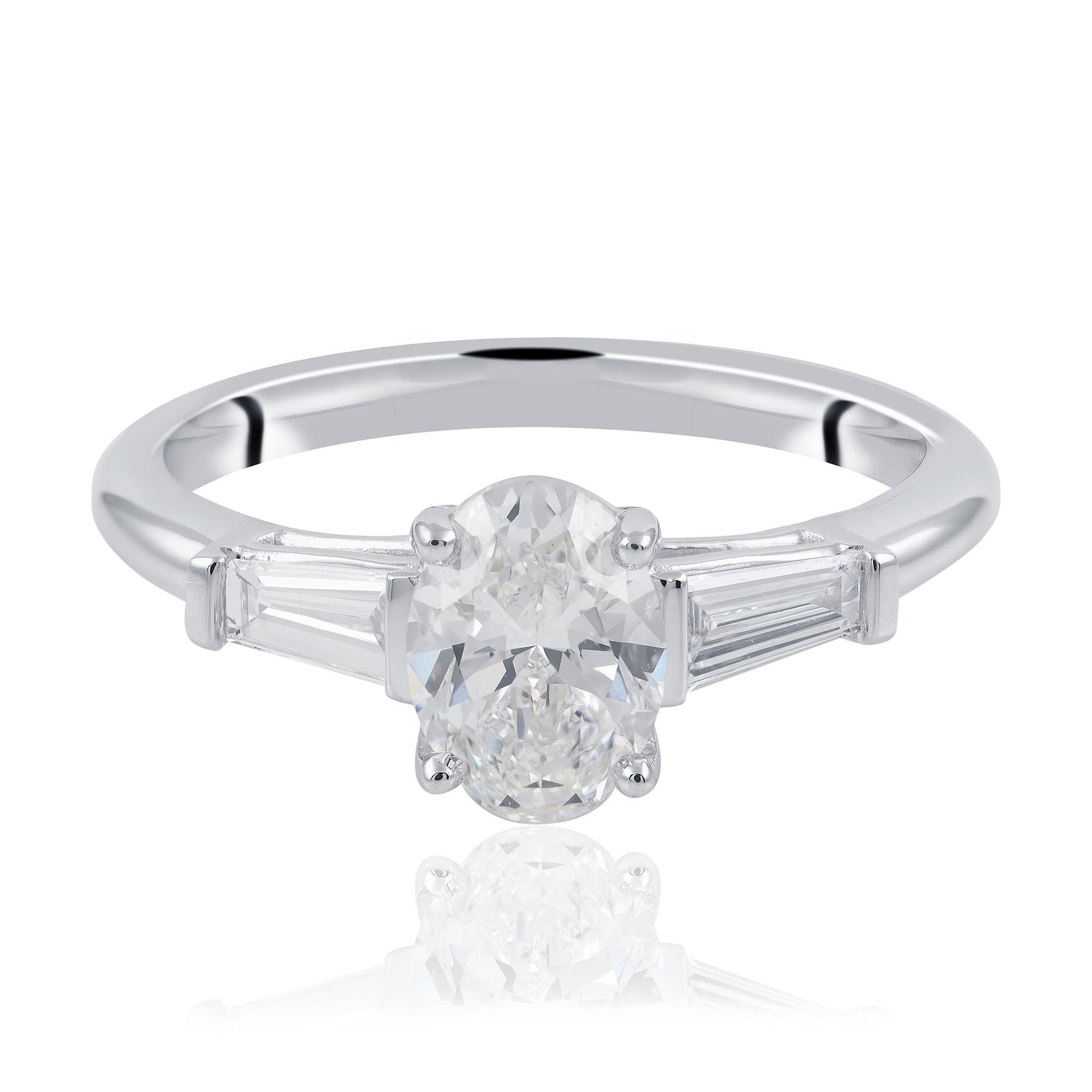 Oval cut and tampered baguette diamond engagement ring