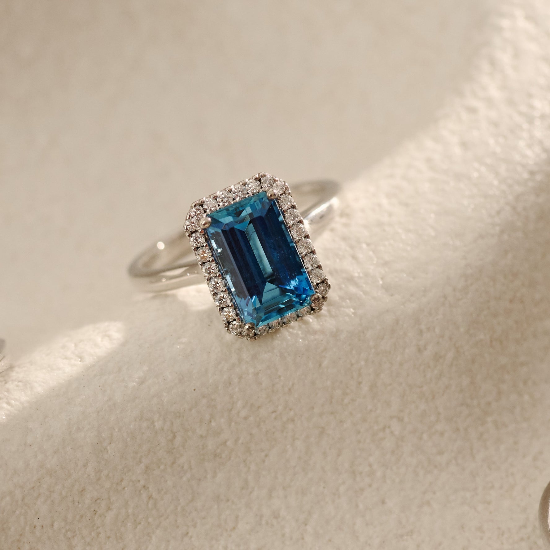 2.71ct Emerald Cut Aquamarine and Diamond Halo